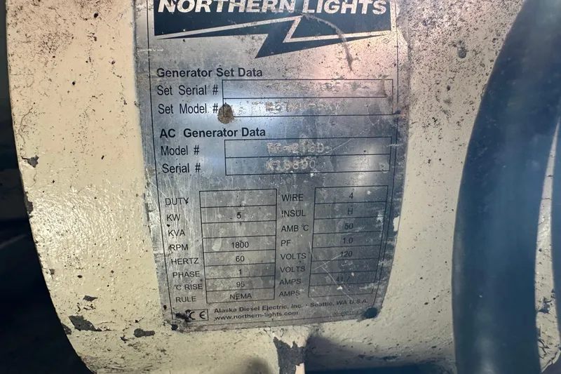 Slide: The Image of Northern Lights generator data plate on 2004 Mainship Pilot 30, showing specifications and serial numbers. - 21