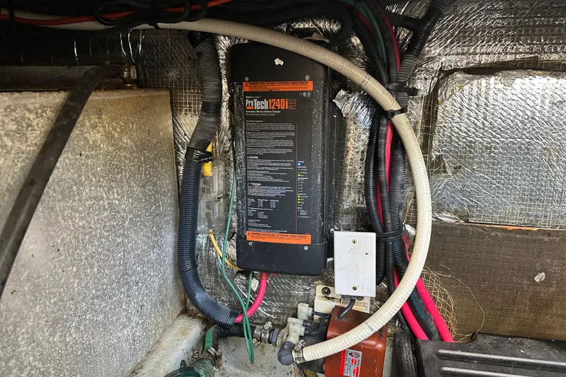 Slide: The Image of Electrical wiring and ProMariner ProTech 1240i Plus charger in 2004 Mainship Pilot 30 boat. - 24