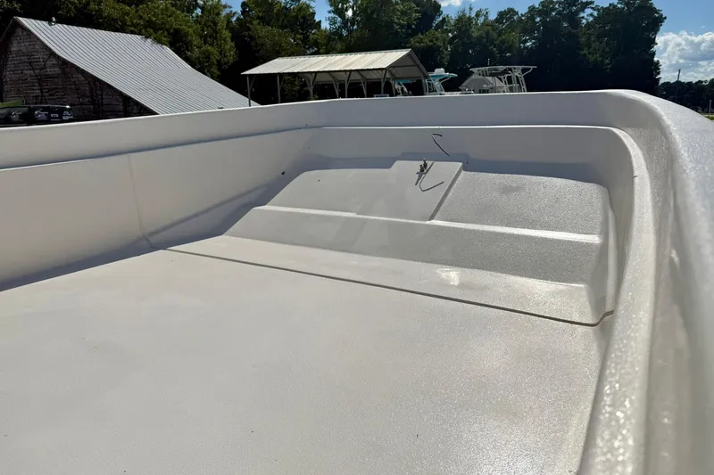Slide: The Image of 2026 Carolina Skiff E24 DLX Kit Boat deck, showcasing spacious and sleek design. - 11