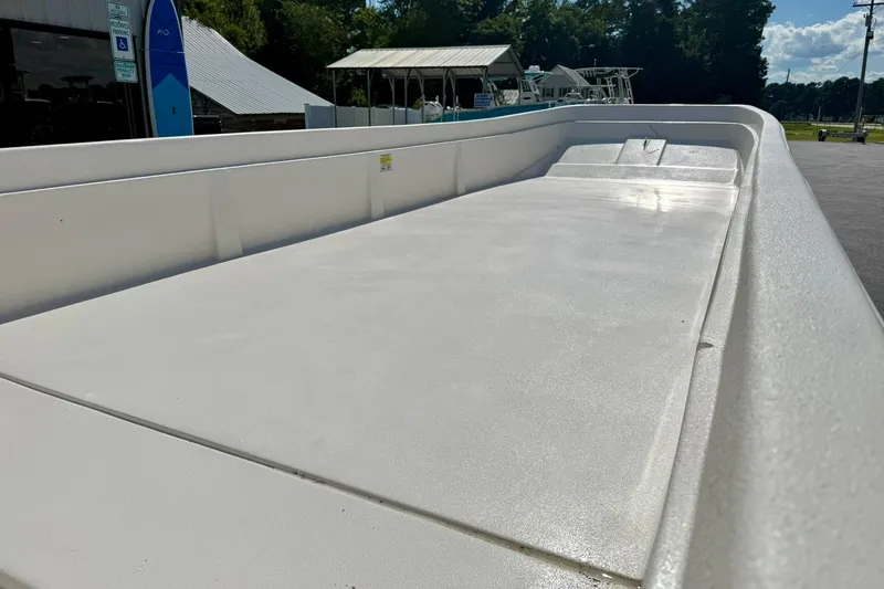 Slide: The Image of 2026 Carolina Skiff E24 DLX Kit Boat, spacious deck, outdoor display. - 13