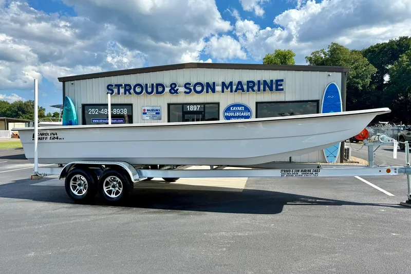 Slide: The Image of 2026 Carolina Skiff E24 DLX Kit Boat on trailer at Stroud & Son Marine. - 3