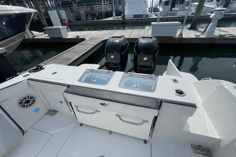 Slide: The Image of 2023 Crevalle 33 CSF boat with dual engines docked at marina. - 17