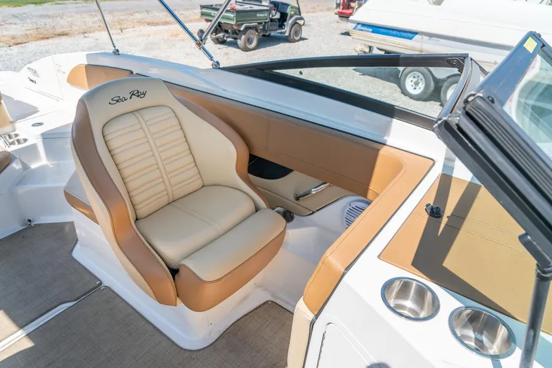 Slide: The Image of 2018 Sea Ray SPX 210 boat interior with tan and cream seating. - 22