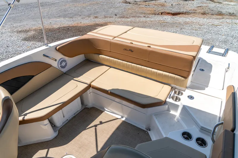 Slide: The Image of 2018 Sea Ray SPX 210 boat interior with tan seating and cup holders. - 23