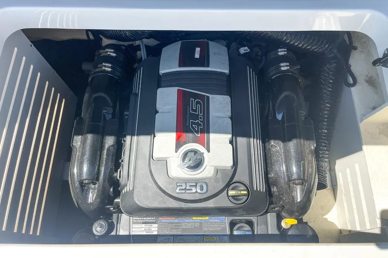 Slide: The Image of Engine compartment of a 2018 Sea Ray SPX 210 boat, featuring a 4.5L 250 HP engine. - 24