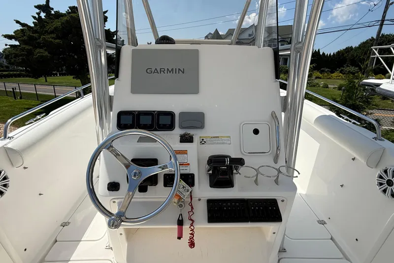 Slide: The Image of 2009 Century 2901 Center Console boat dashboard with Garmin navigation system. - 12