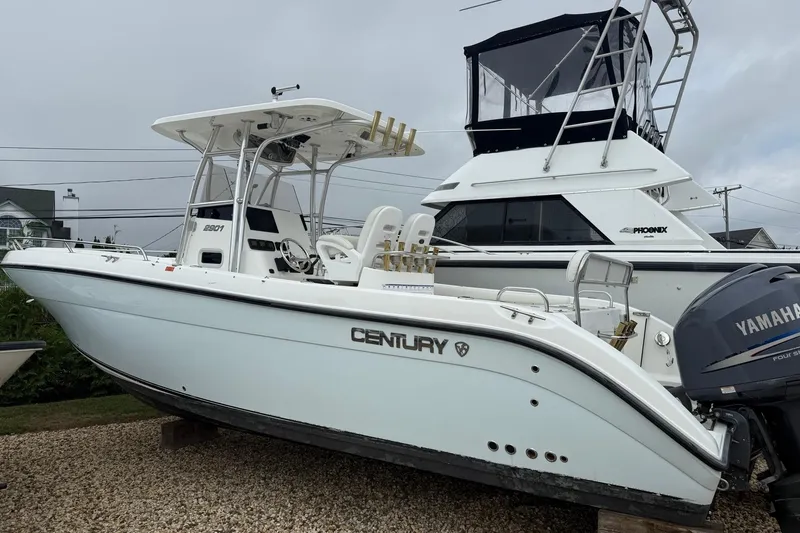 Slide: The Image of 2009 Century 2901 Center Console boat with Yamaha engine, displayed on gravel. - 18