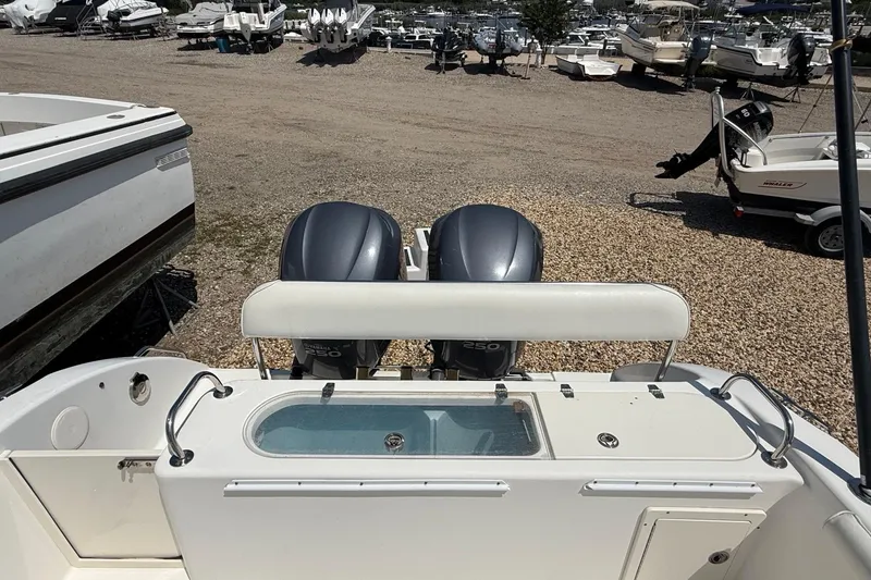 Slide: The Image of 2009 Century 2901 Center Console boat with dual engines in a boatyard. - 7