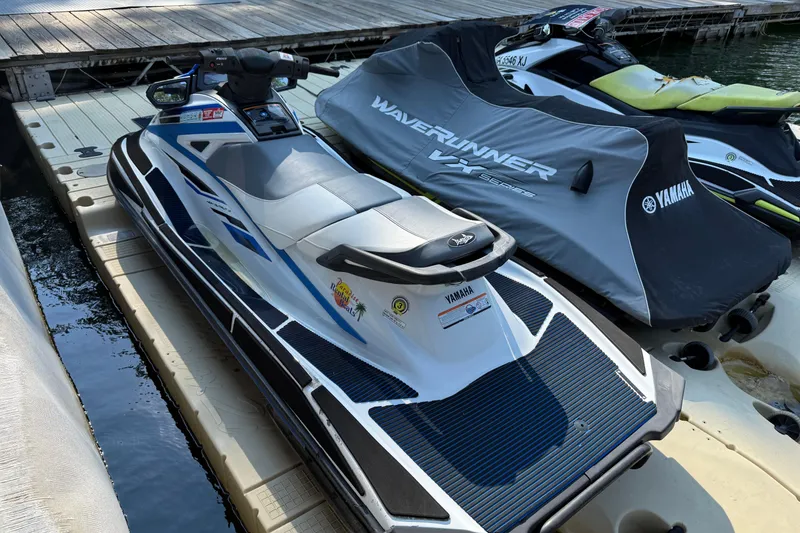 Slide: The Image of 2020 Yamaha WaveRunner VX jet ski docked beside covered watercraft. - 3