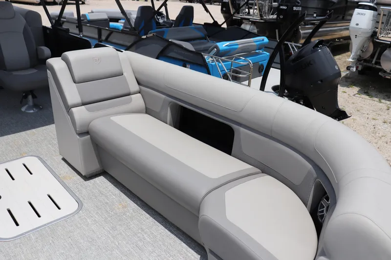 Slide: The Image of Luxurious seating on 2024 Premier 250 Solaris Rev pontoon boat, featuring sleek design and comfort. - 3