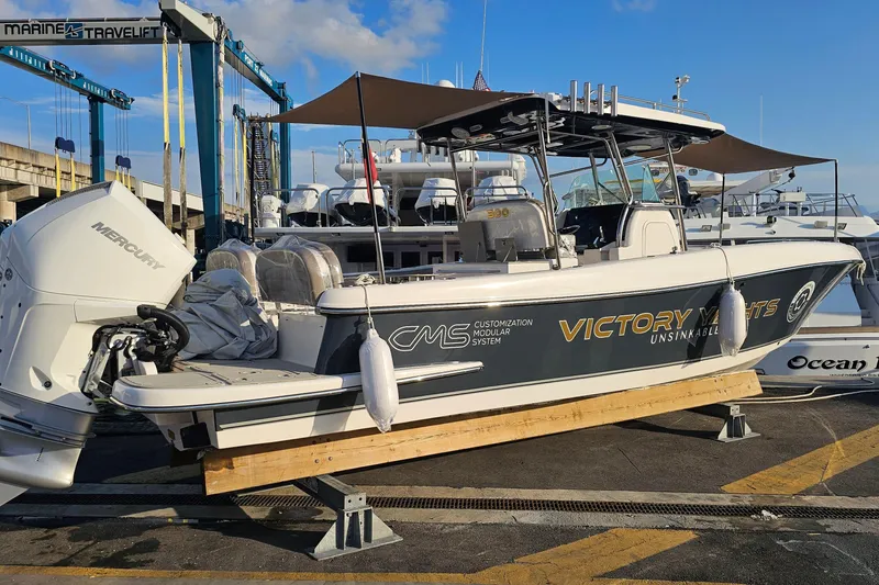 Slide: The Image of 2024 Victory Yachts V300 boat with Mercury engine at marina, showcasing customization features. - 15
