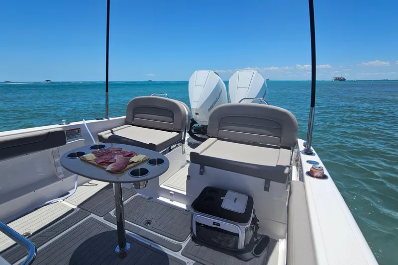 Slide: The Image of 2024 Victory Yachts V300 interior with seating, table, and ocean view. - 9