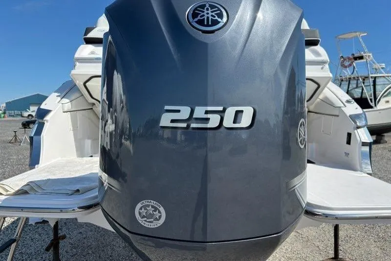 Slide: The Image of 2023 Regal LX4 boat with Yamaha 250 outboard engine, displayed outdoors. - 13