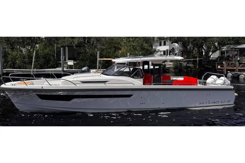 The Image of 2025 Nimbus Tender 11 boat with sleek design and vibrant red seating. - 0