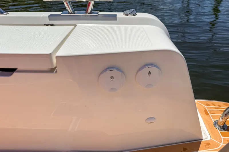 Slide: The Image of Close-up of 2025 Nimbus Tender 11 boat deck with water access ports. - 5