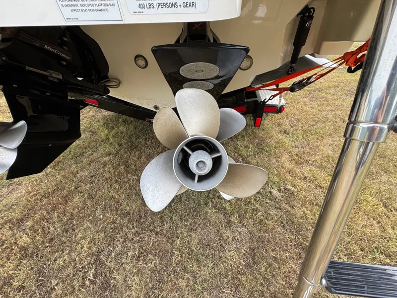 Slide: The Image of Propeller of 2022 Sea Ray SLX 310 boat on grass, close-up view. - 23