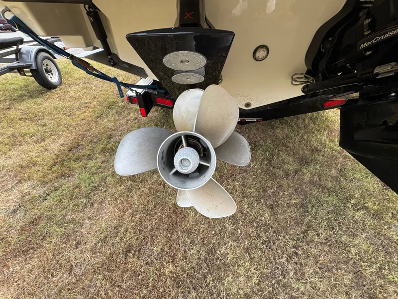 Slide: The Image of Propeller of 2022 Sea Ray SLX 310 boat on grass. - 24