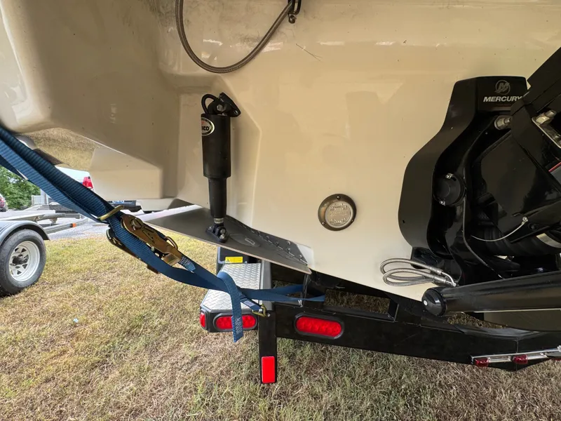 Slide: The Image of 2022 Sea Ray SLX 310 boat trailer hitch and engine detail. - 25