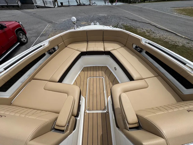 Slide: The Image of 2022 Sea Ray SLX 310 boat with tan leather seating and teak flooring. - 41