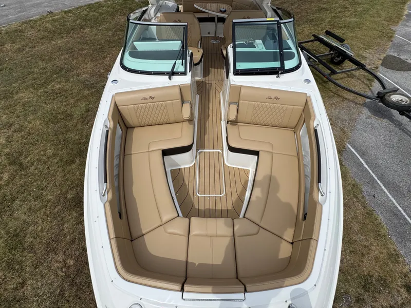 Slide: The Image of 2022 Sea Ray SLX 310 boat with tan leather seating and sleek design. - 42