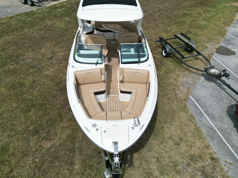 Slide: The Image of 2022 Sea Ray SLX 310 boat on grass with trailer, aerial view. - 43