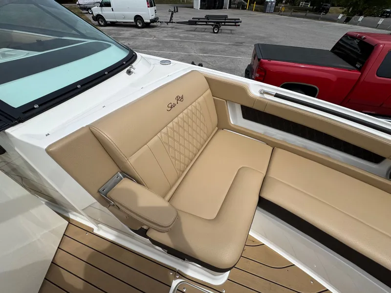 Slide: The Image of 2022 Sea Ray SLX 310 boat with tan leather seating and elegant design. - 48