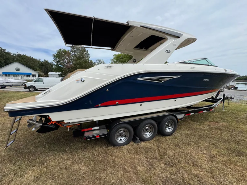 Slide: The Image of 2022 Sea Ray SLX 310 boat on trailer, featuring sleek design and modern amenities. - 9