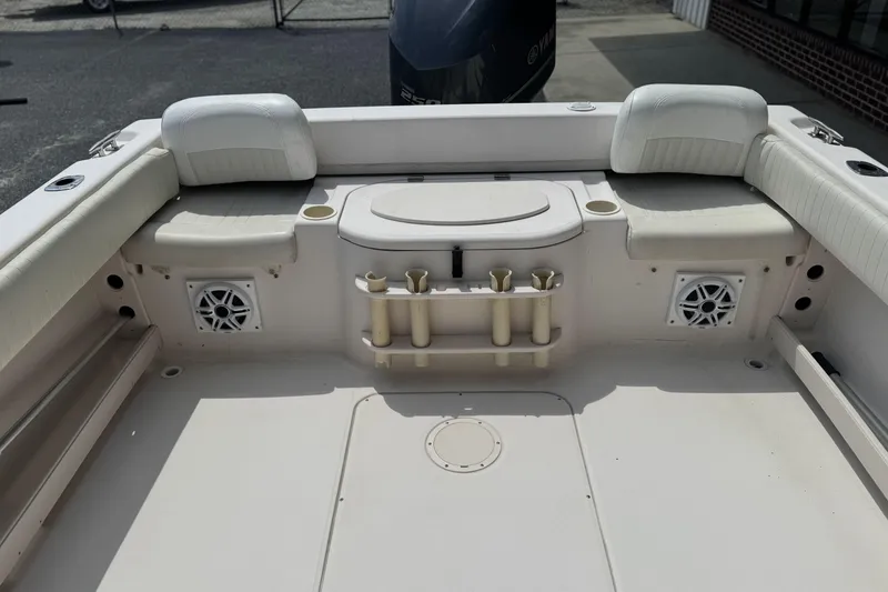 Slide: The Image of 2005 Grady-White Seafarer 228 boat interior with seating and rod holders. - 10