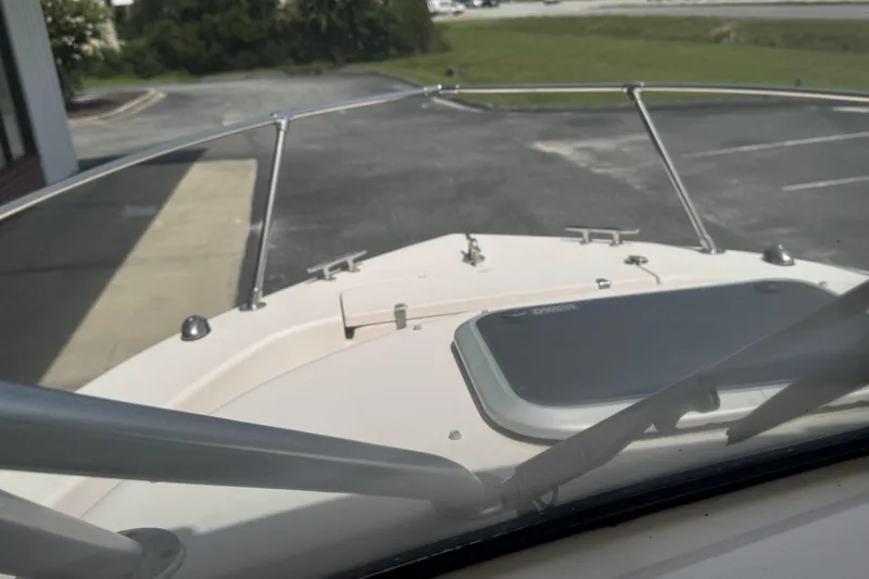 Slide: The Image of 2005 Grady-White Seafarer 228 boat bow view with railing and hatch. - 16