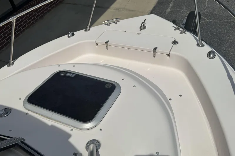 Slide: The Image of 2005 Grady-White Seafarer 228 boat deck with hatch and railing, in sunlight. - 17