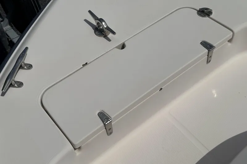 Slide: The Image of 2005 Grady-White Seafarer 228 boat deck with storage compartment and cleats. - 19