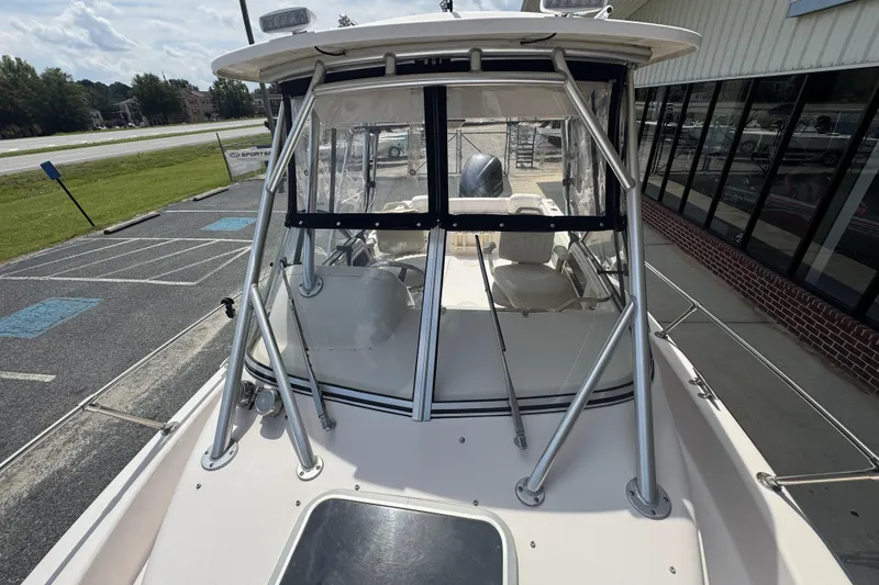 Slide: The Image of 2005 Grady-White Seafarer 228 boat with windshield and metal frame, parked outdoors. - 20