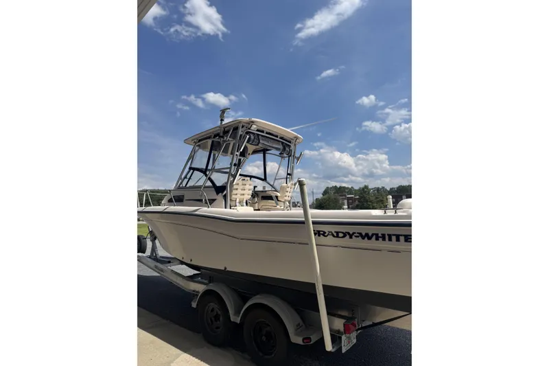 Slide: The Image of 2005 Grady-White Seafarer 228 boat on trailer under blue sky. - 23