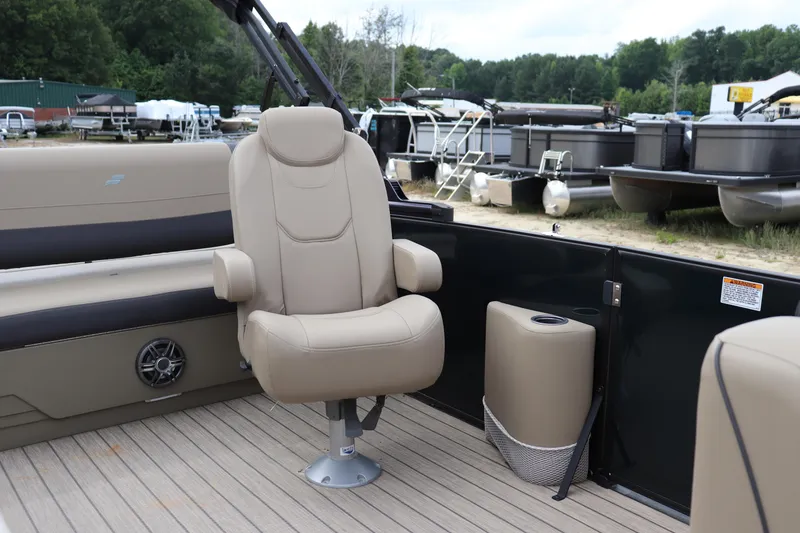 Slide: The Image of 2024 Starcraft 24 EX QDH boat interior with beige seating and wood flooring. - 4