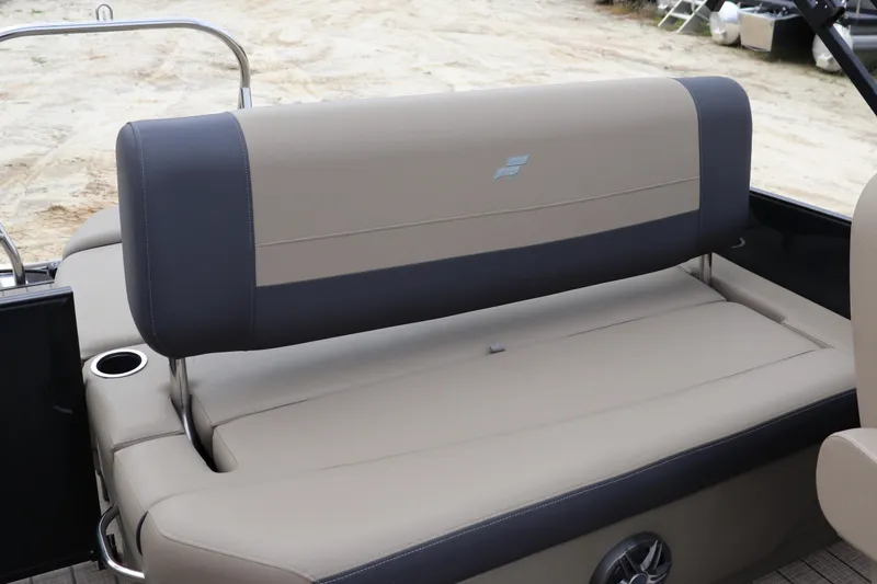 Slide: The Image of 2024 Starcraft 24 EX QDH boat interior with beige and black seating. - 7