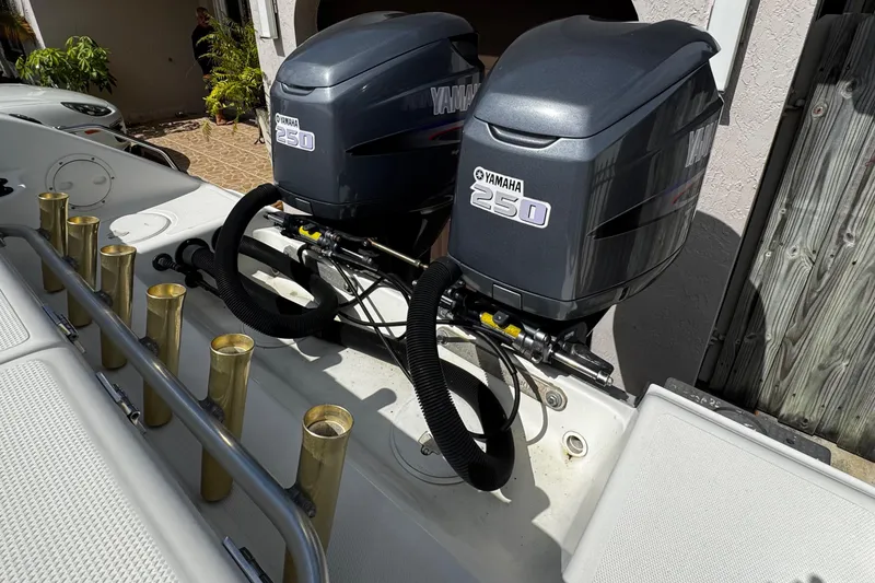 Slide: The Image of 2003 Triton 2895 CC boat with dual Yamaha 250 outboard engines. - 17