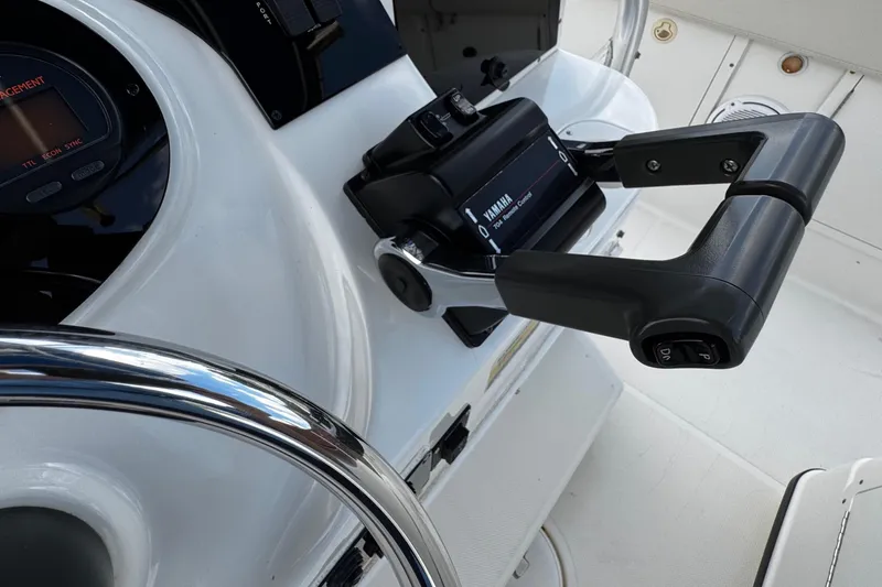 Slide: The Image of 2003 Triton 2895 CC boat helm with Yamaha throttle control and steering wheel. - 40