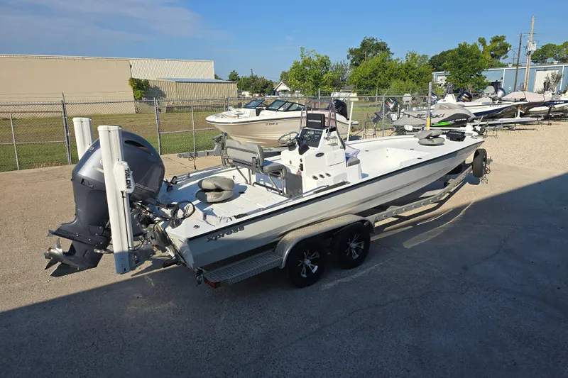 Slide: The Image of 2019 Xpress H24B boat on trailer in outdoor storage area. - 3