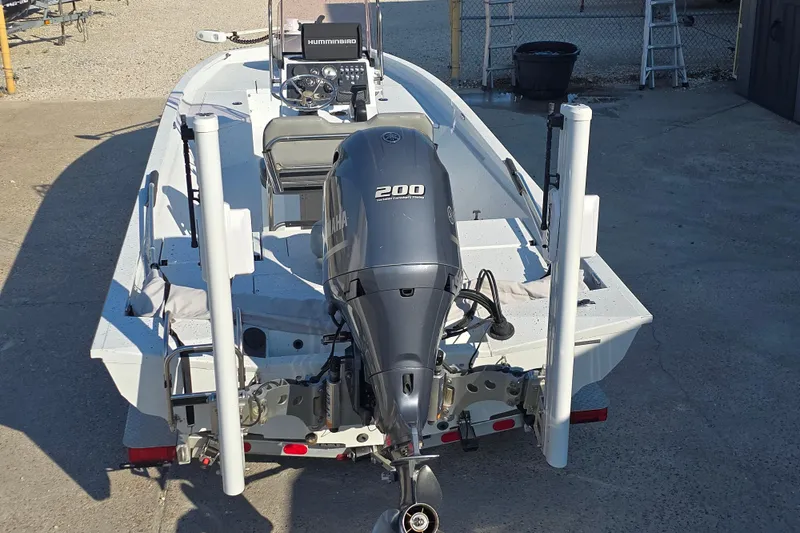 Slide: The Image of 2019 Xpress H24B boat with Yamaha 200 engine, featuring Humminbird electronics. - 4