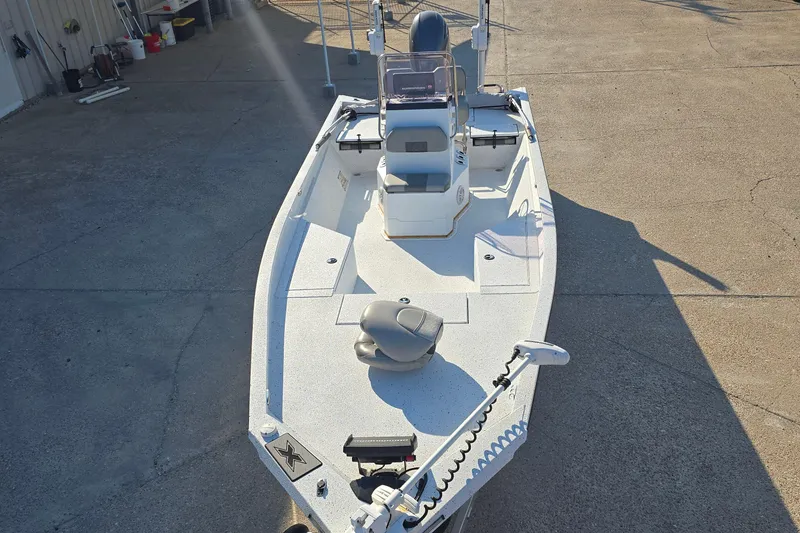Slide: The Image of 2019 Xpress H24B boat on concrete, featuring a sleek design and modern equipment. - 8