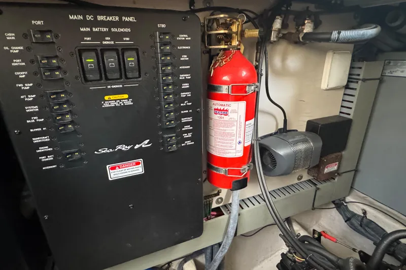 Slide: The Image of Main DC breaker panel and fire extinguisher in 2003 Sea Ray 380 Sundancer boat. - 36