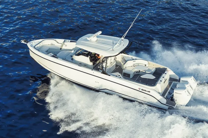 Slide: The Image of 2026 Wellcraft 38 T-Top boat on display, showcasing sleek design and modern features. - 25
