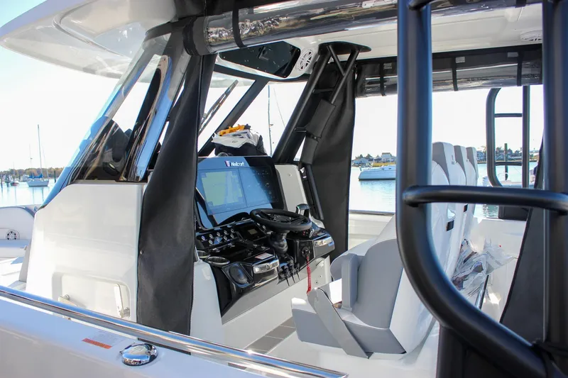 Slide: The Image of 2026 Wellcraft 38 T-Top boat with triple 300 V8 engines on water. - 34