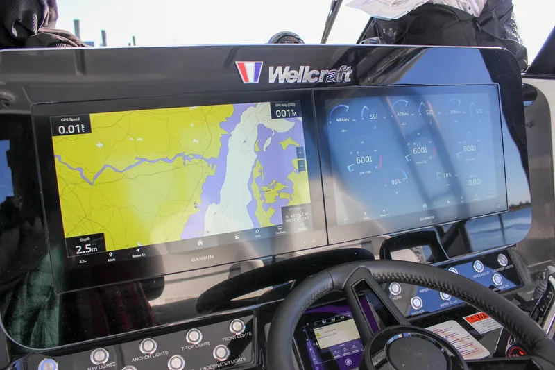 Slide: The Image of 2026 Wellcraft 38 T-Top boat interior with white seating and modern design. - 37