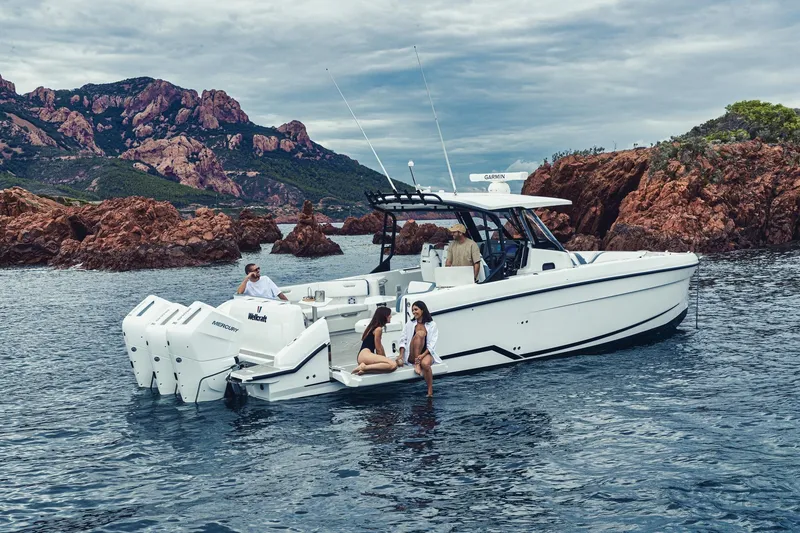Slide: The Image of 2026 Wellcraft 38 T-Top boat with sleek white deck and stainless steel railing. - 42