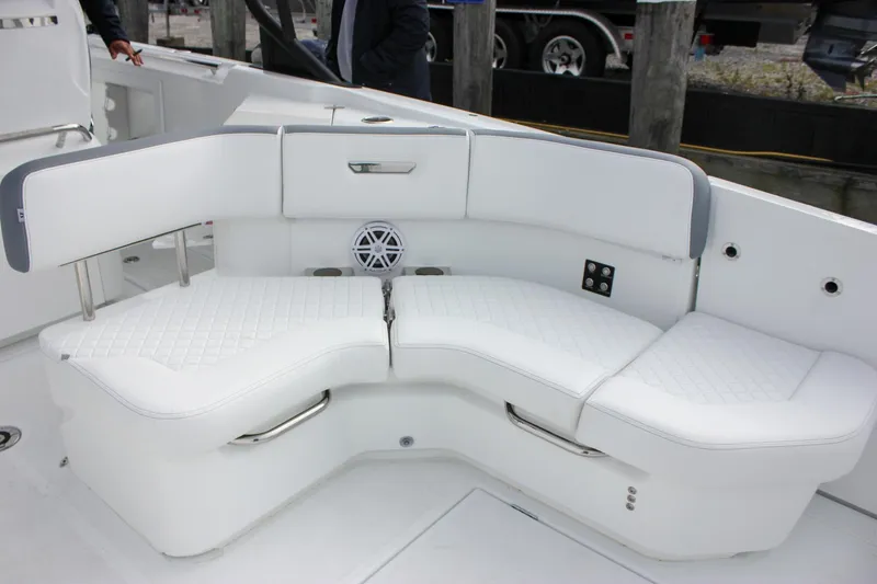 Slide: The Image of Luxurious seating on 2026 Wellcraft 38 T-Top boat, featuring white cushioned upholstery. - 50