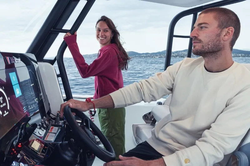 Slide: The Image of Couple enjoying a ride on a 2026 Wellcraft 38 T-Top boat. - 65