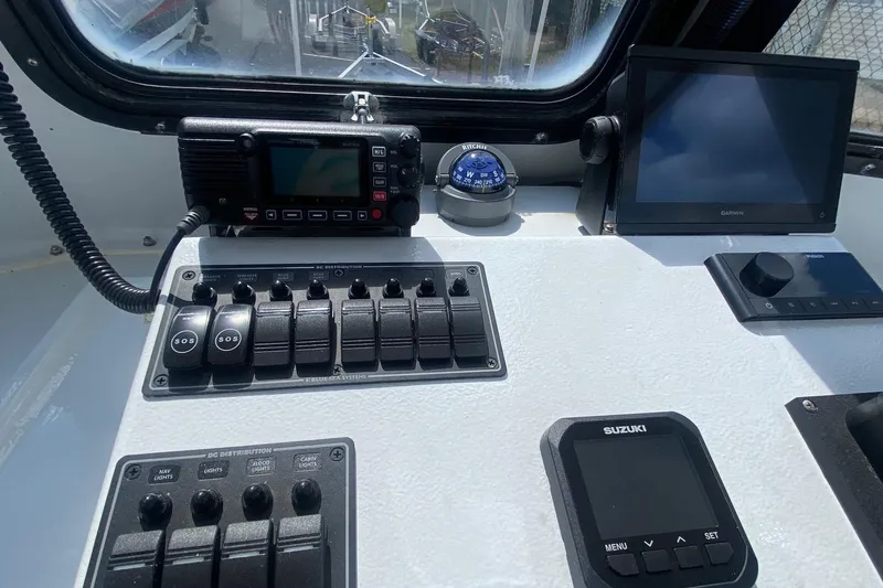 Slide: The Image of Control panel of a 1991 Eastern Lobsterman boat with navigation and communication equipment. - 6