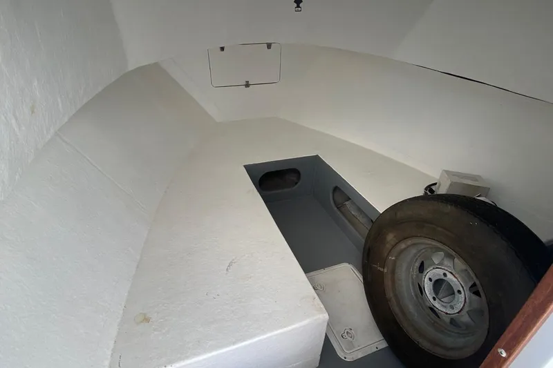 Slide: The Image of Interior of a 1991 Eastern Lobsterman boat with a spare tire. - 10