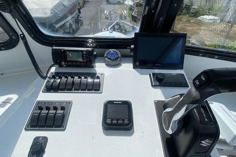 Slide: The Image of Control panel of a 1991 Eastern Lobsterman boat with navigation and communication equipment. - 5